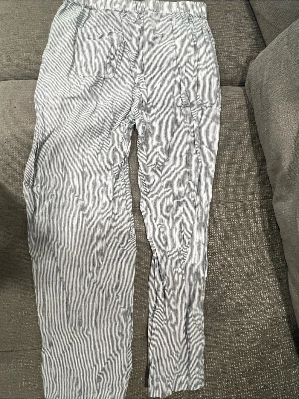 Quince 100% European Linen Tapered Ankle Pants in the Blue Pinstripe pattern.